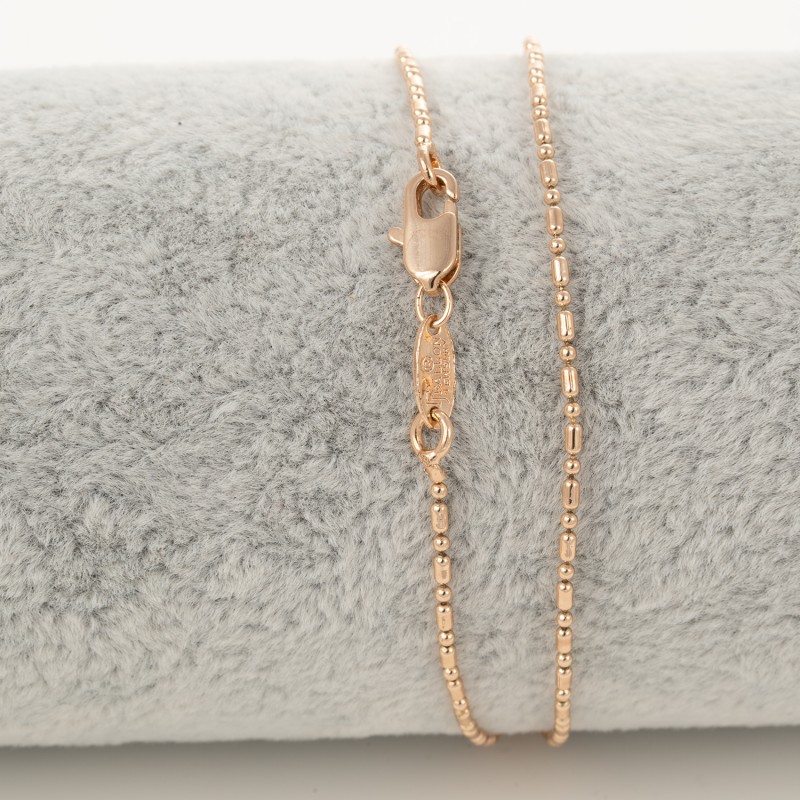 Apzeltītā ķēdīte Bumbiņu un cilindrisku posmu virkne