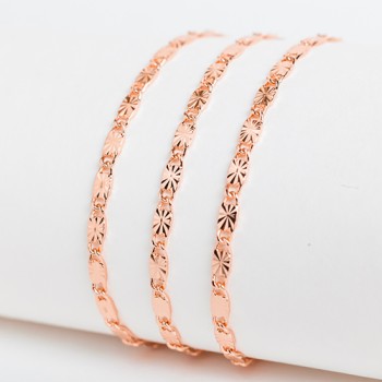 Apzeltītā ķēdīte Masīvā gliemežvāka ar saules staru gravējumu posmu virkne