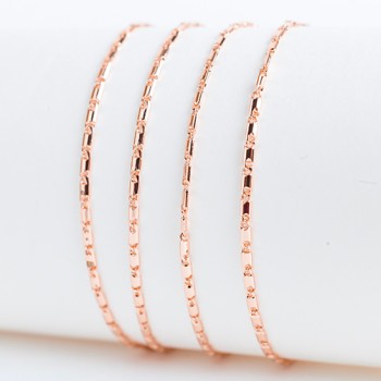 Apzeltītā ķēdīte Vienlaidu glancētu gliemežvāku posmu virkne